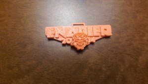Snazzy 3D printed Enabler badge.
